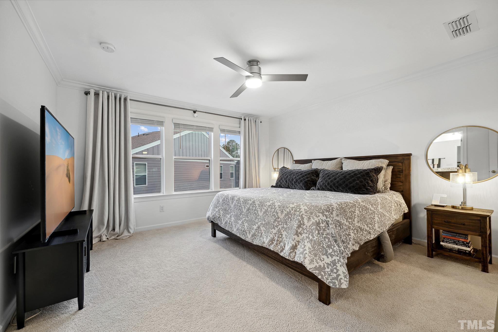 3251 Lynn Road Raleigh, NC 27613 - Photo 20 of 29 a bedroom with bed tv and window