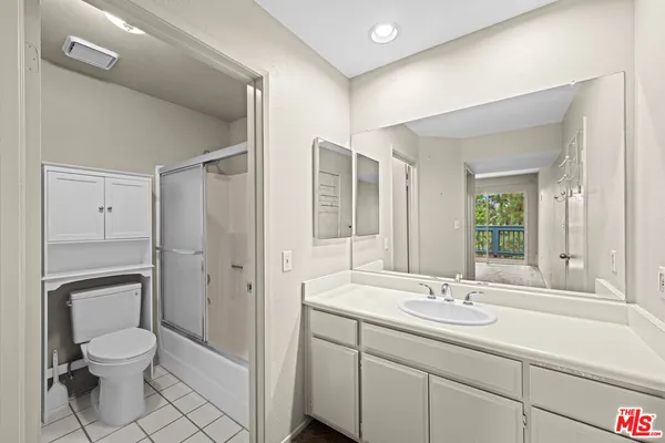 a bathroom with a toilet and a bathtub