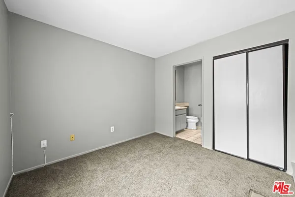 a bathroom with a sink toilet and mirror