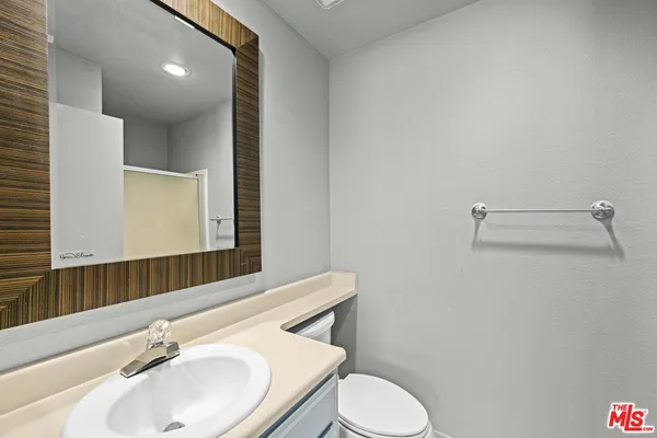 a bathroom with a glass shower door