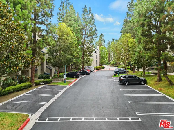 a view of swimming pool with outdoor seating and plants