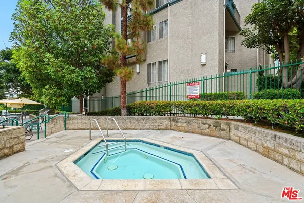 a view of a swimming pool with a patio