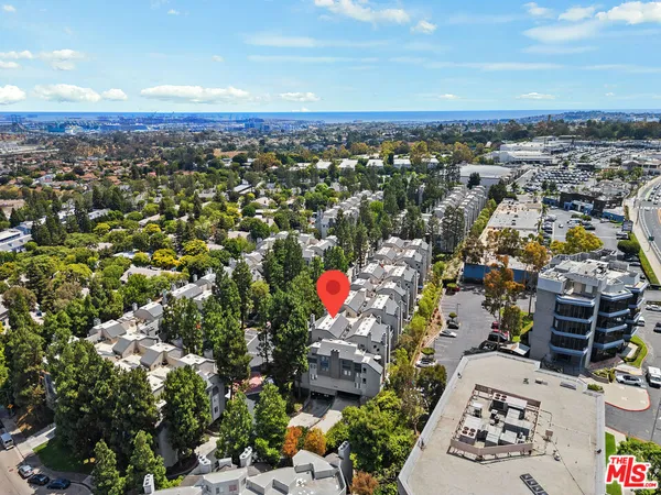 an aerial view of a city with lots of residential buildings