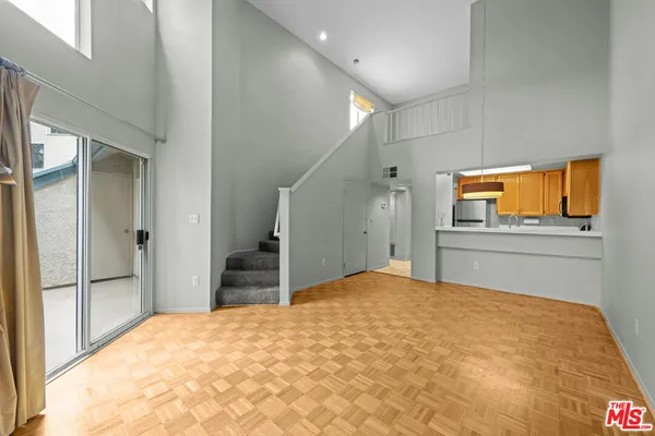 a kitchen with stainless steel appliances a stove a sink and a microwave