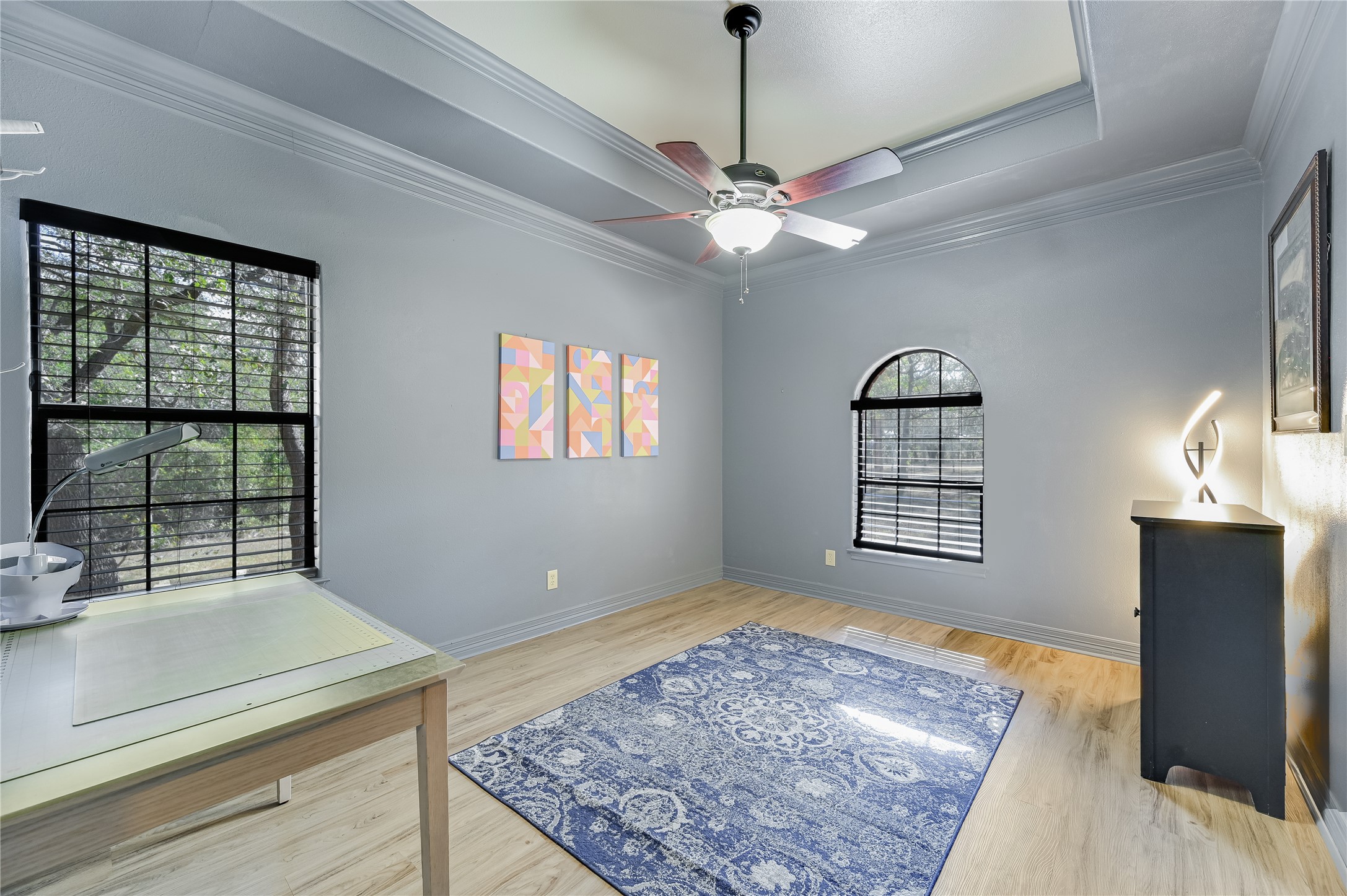 486 Westwood Road Lockhart, TX 78644 - Photo 16 of 29 Large bedroom can be used as office space, playroom, exercise or a bedroom featuring decorative molding, light wood-style flooring, and ceiling fan