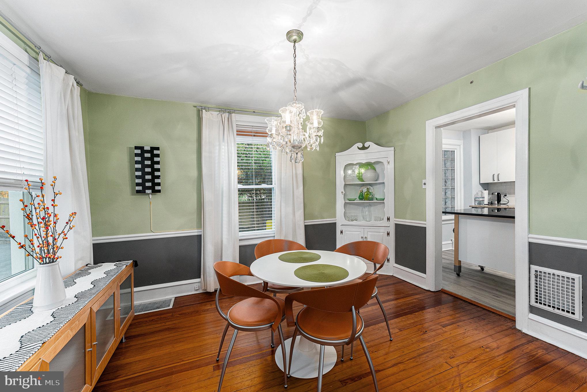 14 Springfield Avenue Flourtown, PA 19031 - Photo 13 of 34 a view of a dining room with furniture a chandelier and wooden floor