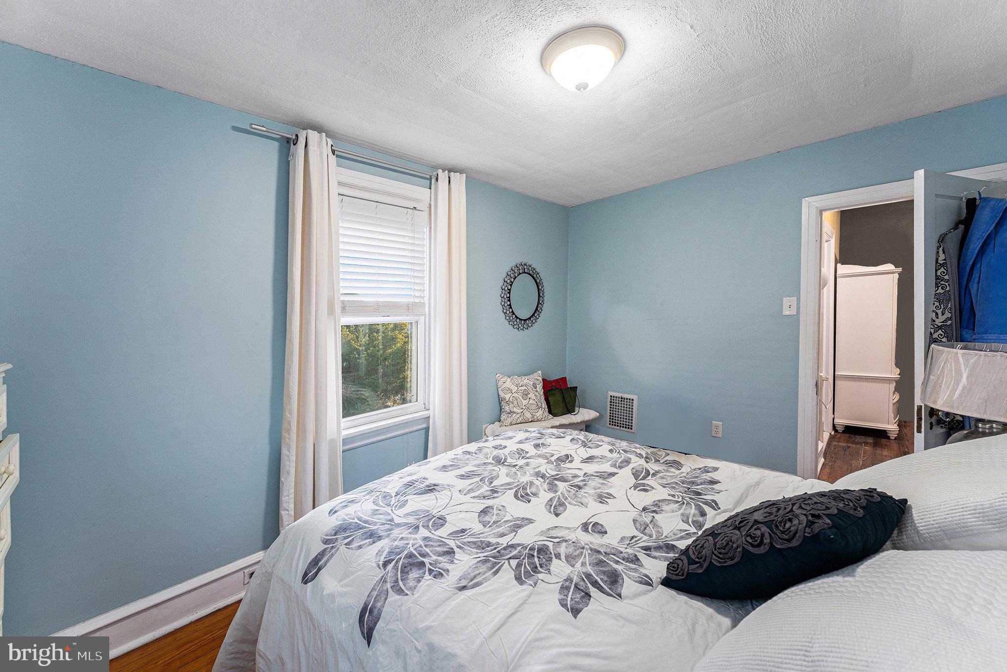 14 Springfield Avenue Flourtown, PA 19031 - Photo 20 of 34 a bedroom with a bed and a window