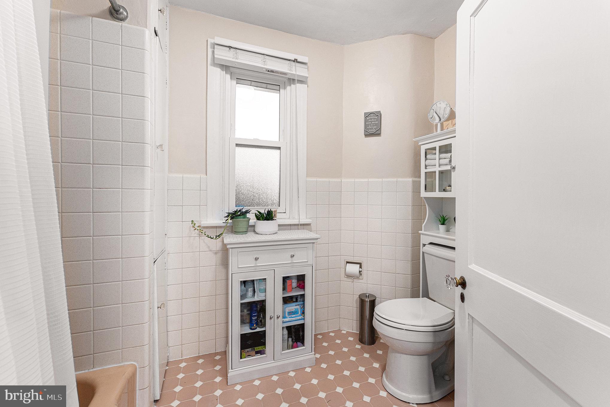 14 Springfield Avenue Flourtown, PA 19031 - Photo 24 of 34 a bathroom with a toilet sink and shower