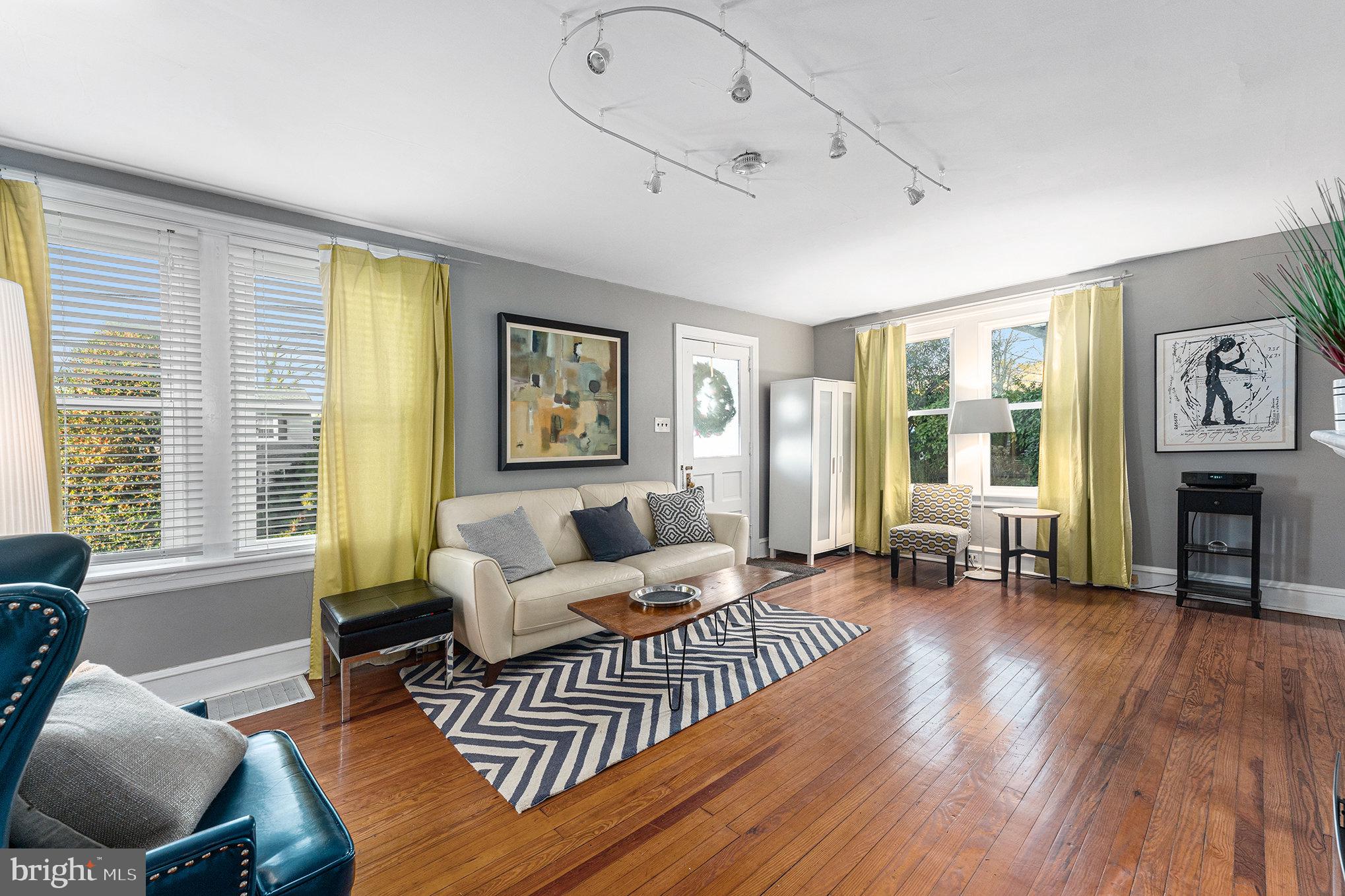 14 Springfield Avenue Flourtown, PA 19031 - Photo 9 of 34 a living room with furniture and a fireplace