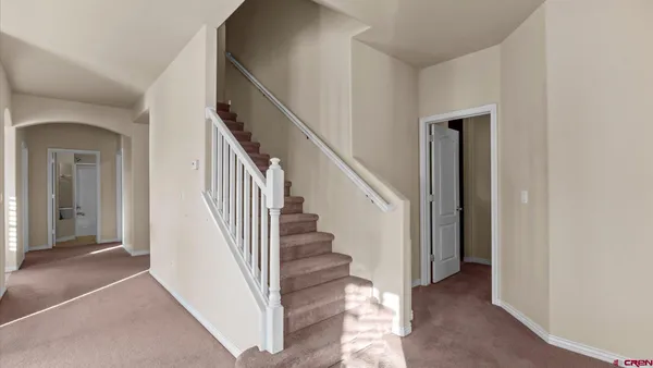 a view of an empty room with windows