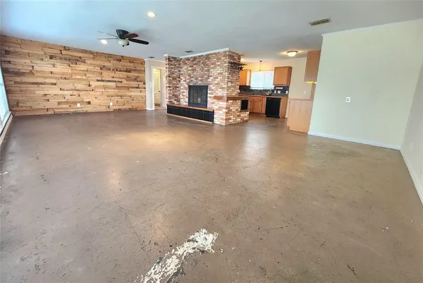 a view of a livingroom with furniture and a fireplace