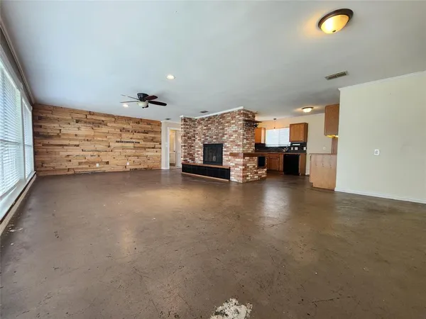 a view of a livingroom with furniture and a fireplace