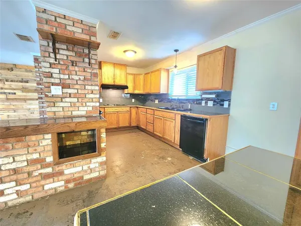 a kitchen with stainless steel appliances granite countertop a stove and a sink