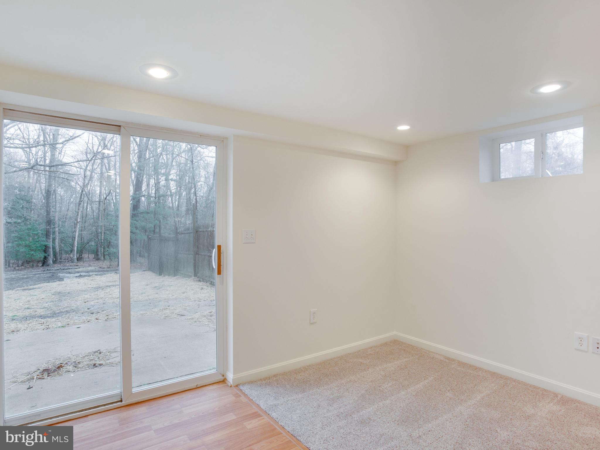 551 Camp Conoy Road Lusby, MD 20657 - Photo 22 of 26 wooden floor in an empty room with a window
