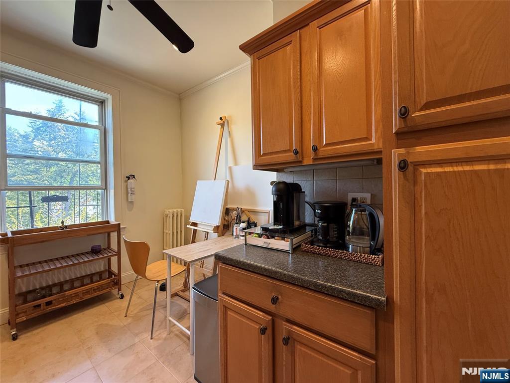 215 Orient Way, Unit C2 Rutherford, NJ 07070 - Photo 14 of 25 a view of a kitchen with kitchen island a sink and a window