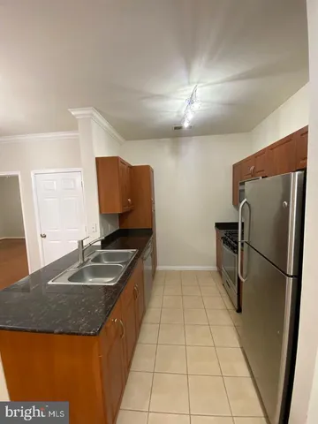 a stove top oven sitting inside of a kitchen