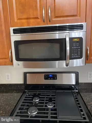 a sink with granite countertop a sink and cabinets