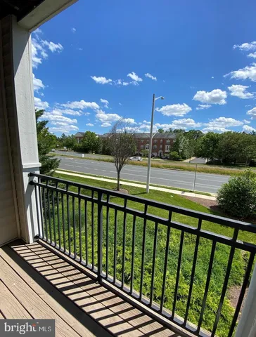 a room with pool table and windows