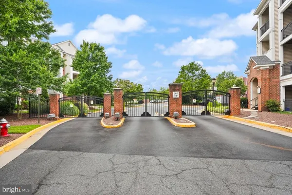 a view of a street with cars parked
