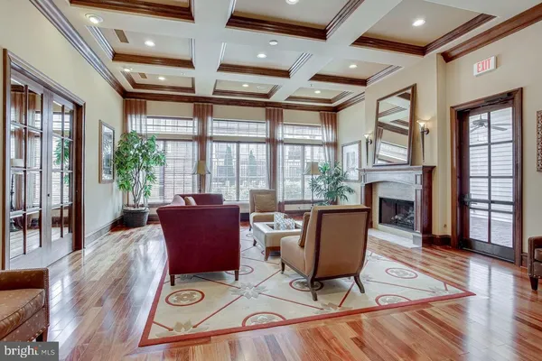 a living room with furniture and large windows