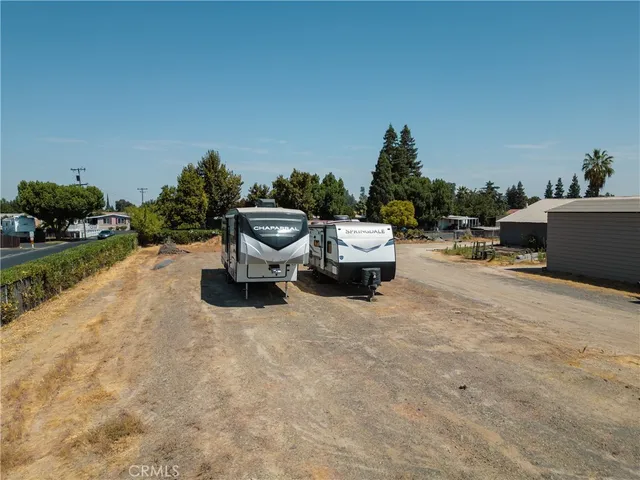 a view of a two chairs in a patio
