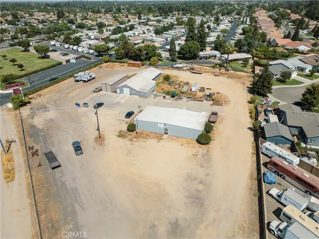 an aerial view of residential houses with outdoor space