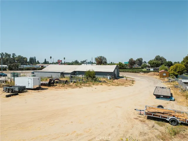 a view of a swimming pool with a lawn chairs