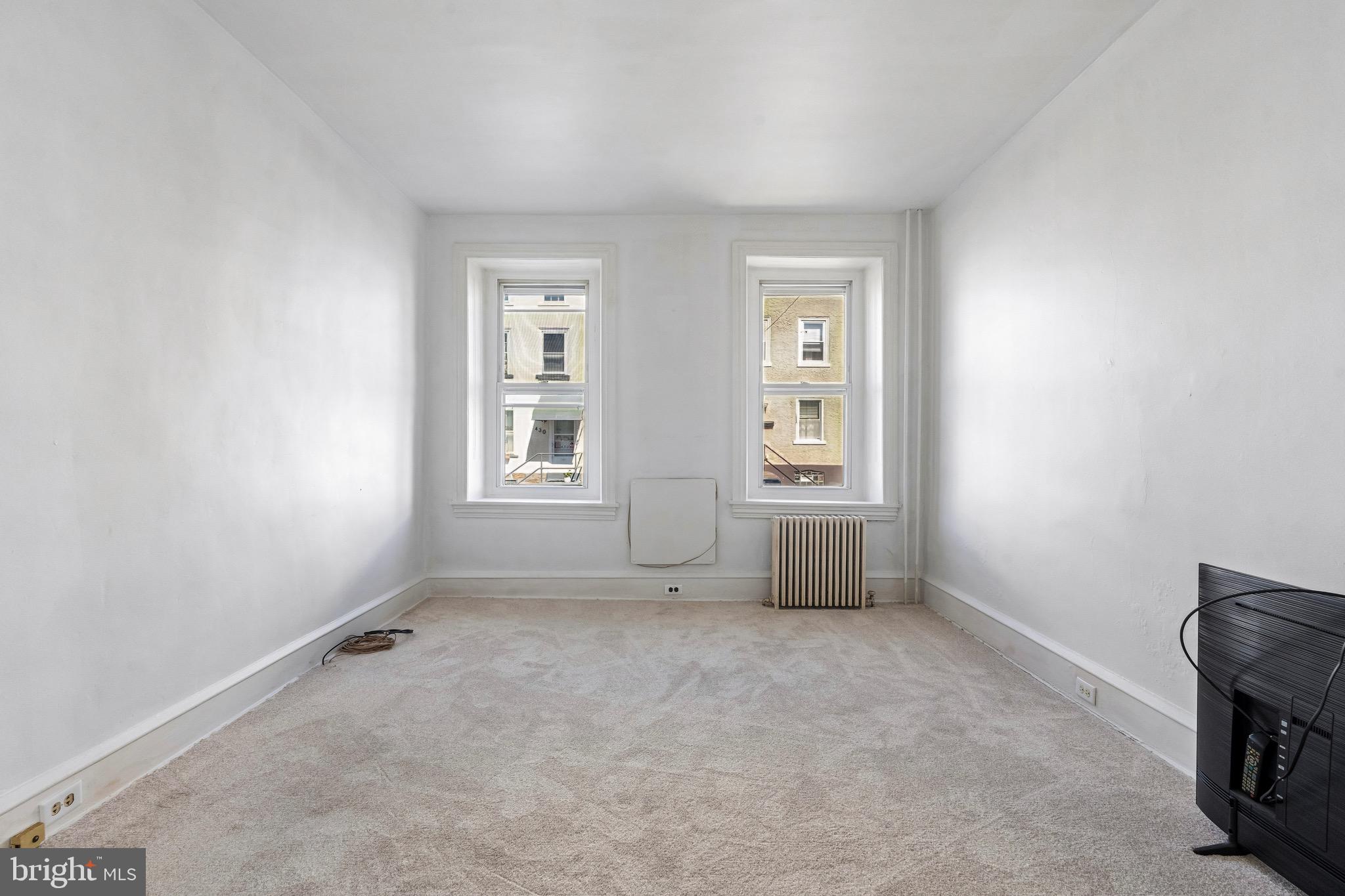 439 Lemonte Street Philadelphia, PA 19128 - Photo 13 of 42 an empty room with windows and closet