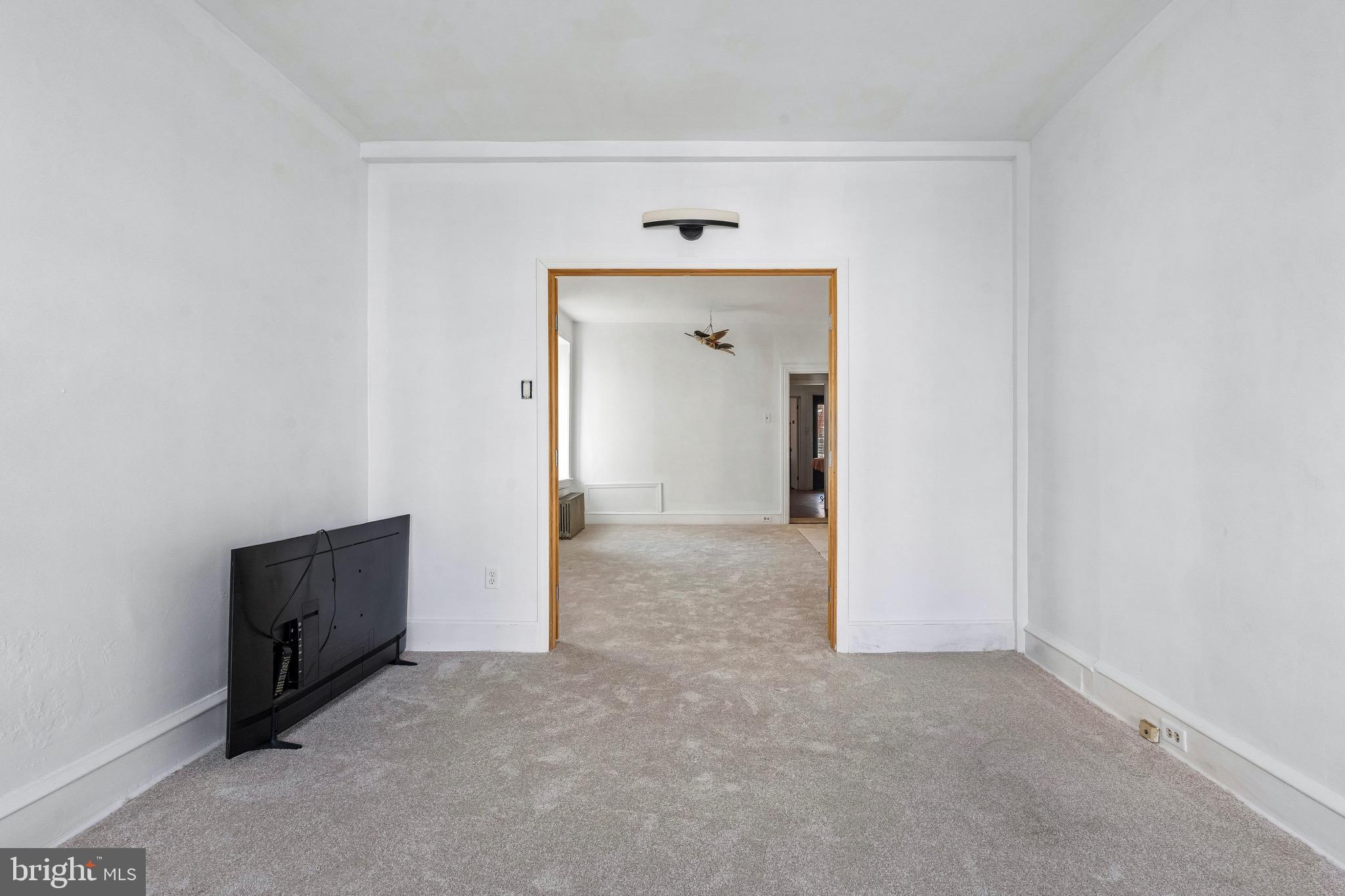 439 Lemonte Street Philadelphia, PA 19128 - Photo 14 of 42 an empty room with closet and wooden door