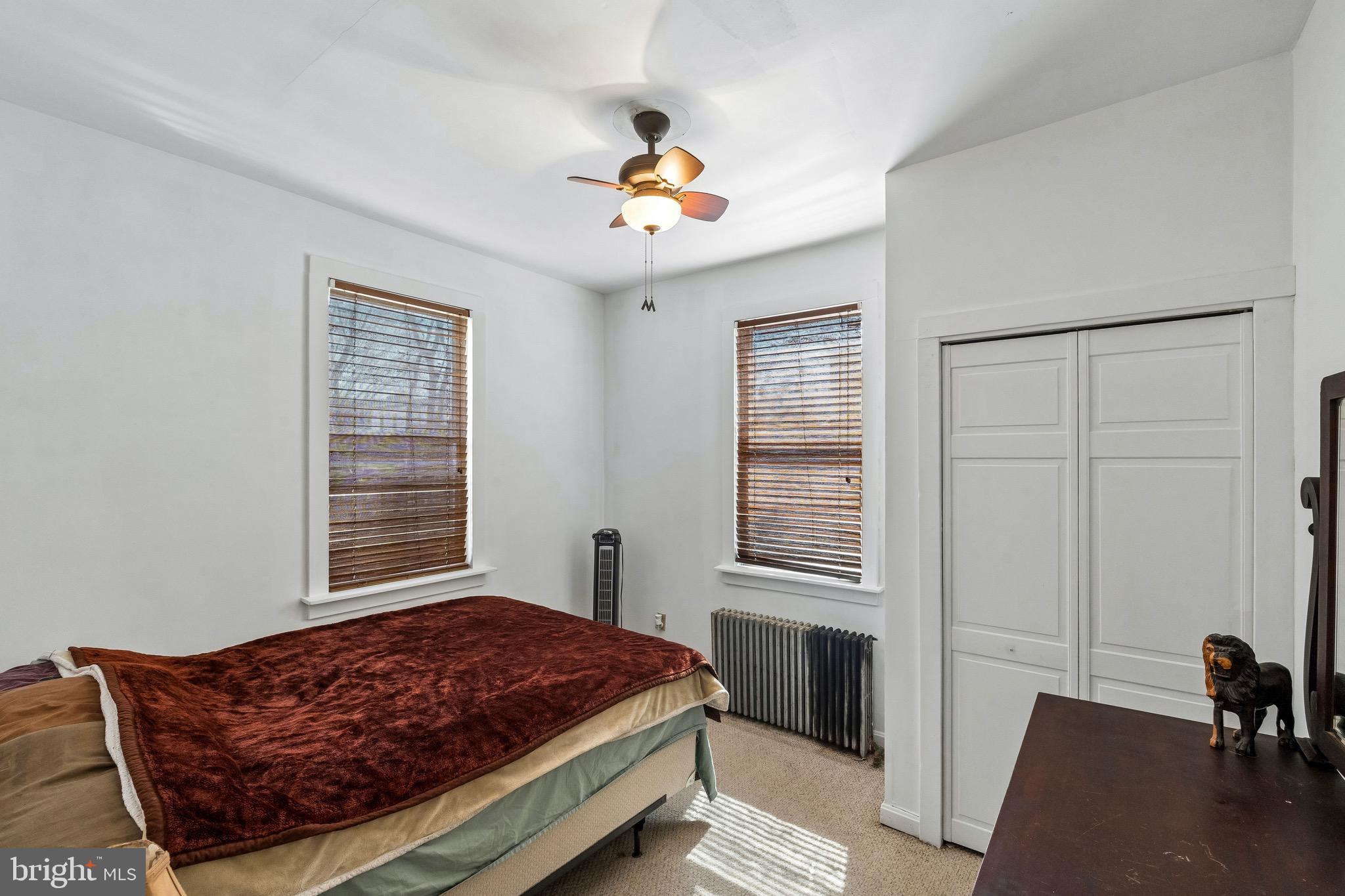 439 Lemonte Street Philadelphia, PA 19128 - Photo 19 of 42 a living room with a bed furniture and a window