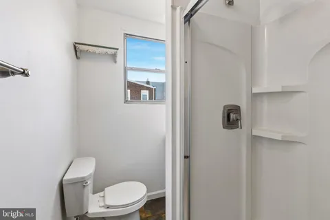 a kitchen with a stove a refrigerator and a sink