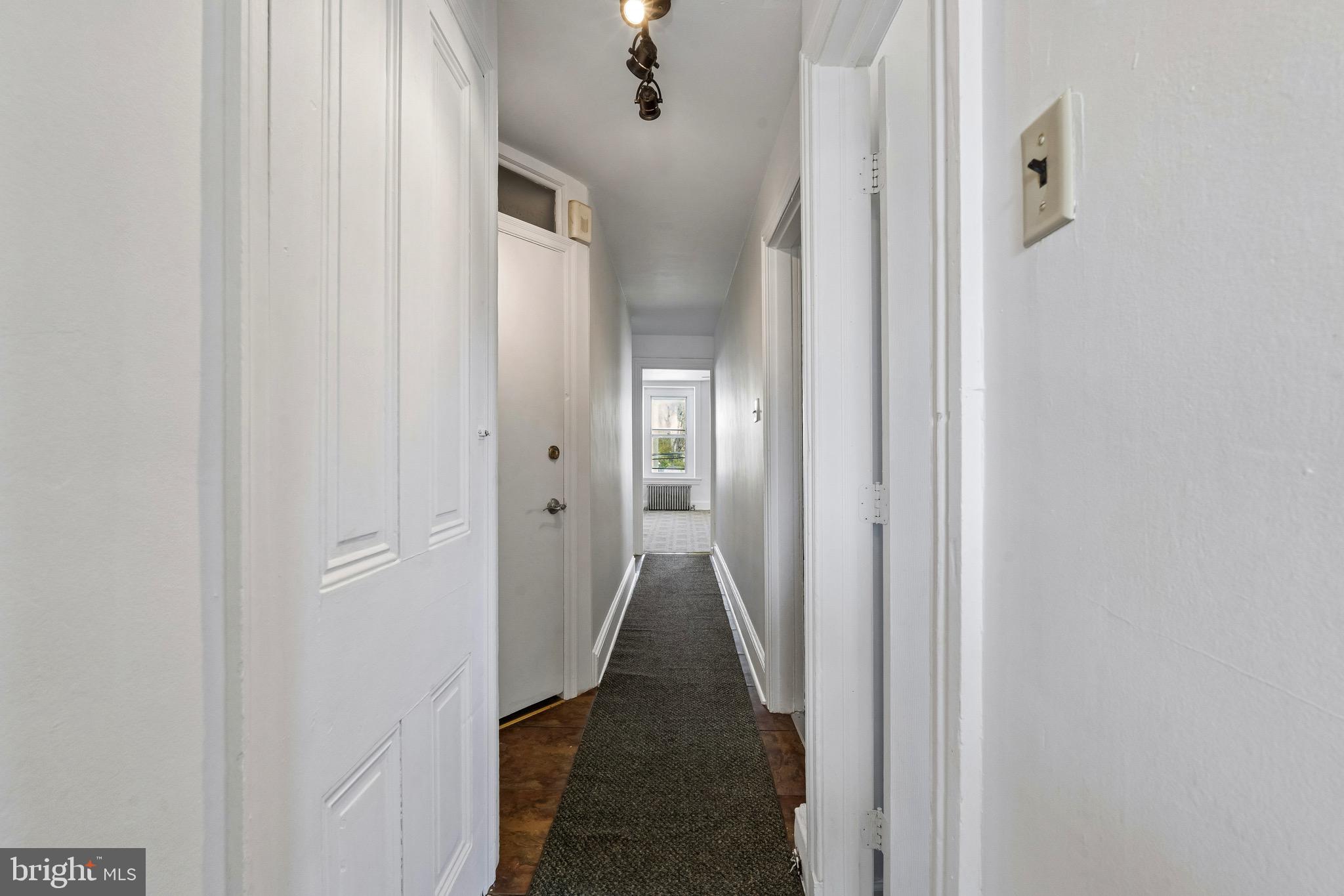 439 Lemonte Street Philadelphia, PA 19128 - Photo 30 of 42 a view of a hallway with a wooden floor
