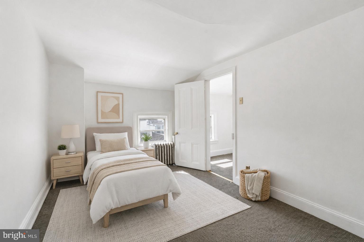 439 Lemonte Street Philadelphia, PA 19128 - Photo 8 of 42 a bedroom with a bed and a window