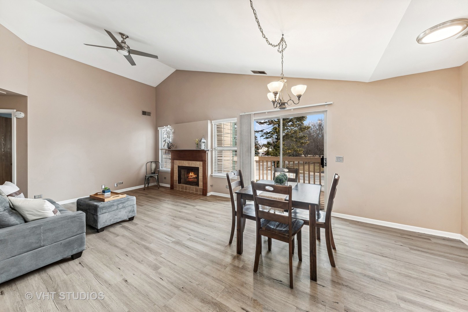 918 Ridgefield Lane Wheeling, IL 60090 - Photo 11 of 22 a dining room with furniture a chandelier and wooden floor