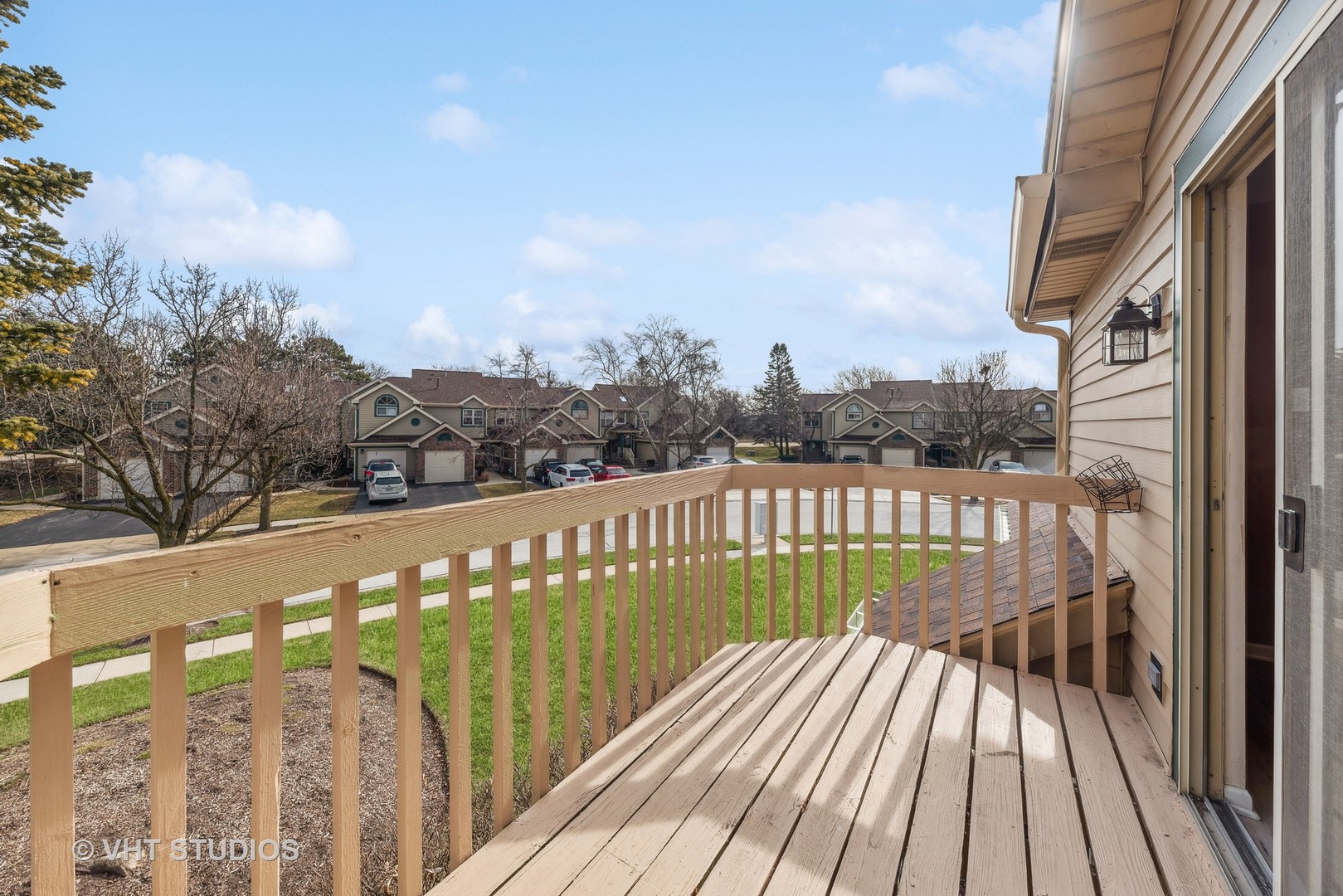 918 Ridgefield Lane Wheeling, IL 60090 - Photo 18 of 22 a view of balcony with wooden floor and fence