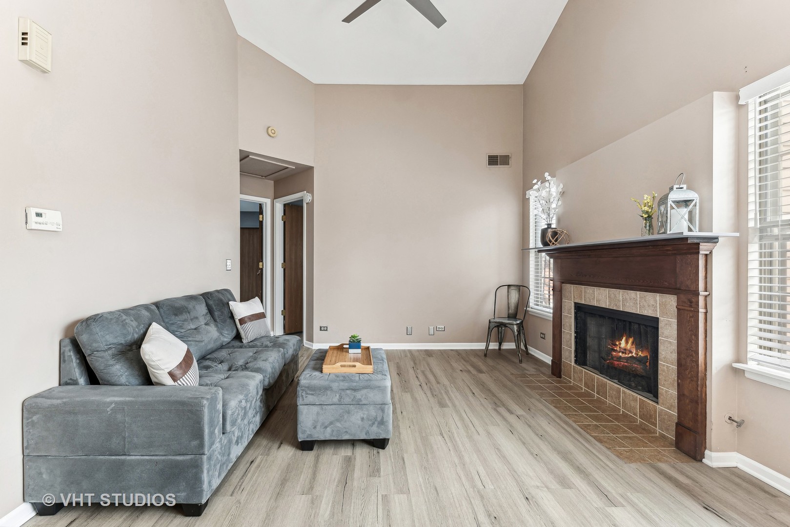 918 Ridgefield Lane Wheeling, IL 60090 - Photo 9 of 22 a living room with furniture and a fireplace