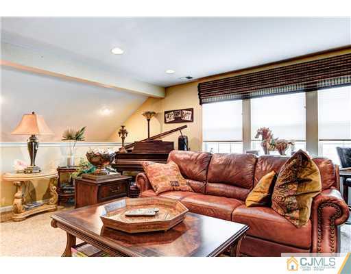 16 Pebble Creek Road Dayton, NJ 08810 - Photo 12 of 25 a living room with furniture and a large window