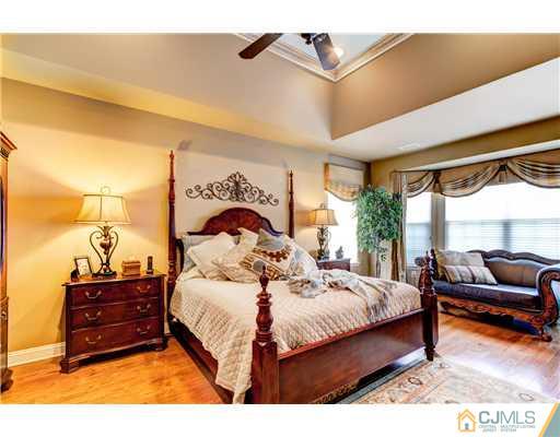 16 Pebble Creek Road Dayton, NJ 08810 - Photo 13 of 25 a bedroom with a bed and a couch