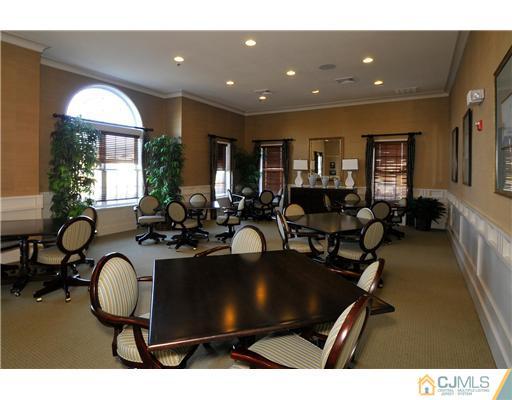 16 Pebble Creek Road Dayton, NJ 08810 - Photo 25 of 25 a living room with furniture a large window and gym equipment