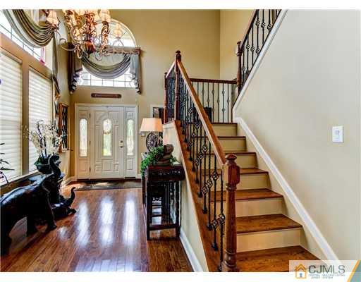 16 Pebble Creek Road Dayton, NJ 08810 - Photo 4 of 25 a view of entryway and hall with wooden floor