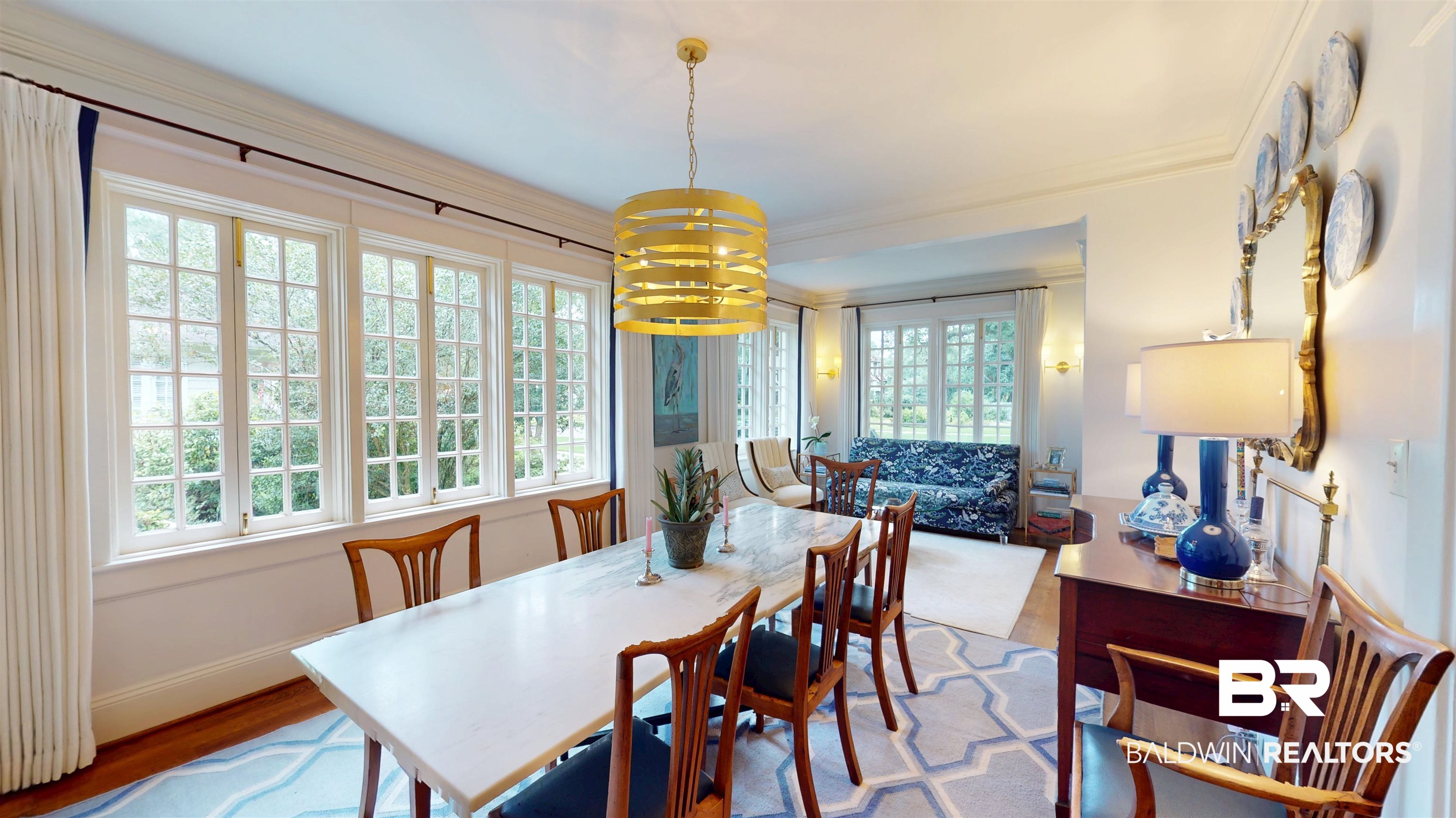 211 Lanier Avenue Mobile, AL 36607 - Photo 24 of 73 Dining area featuring a chandelier, wood finished floors, and crown molding