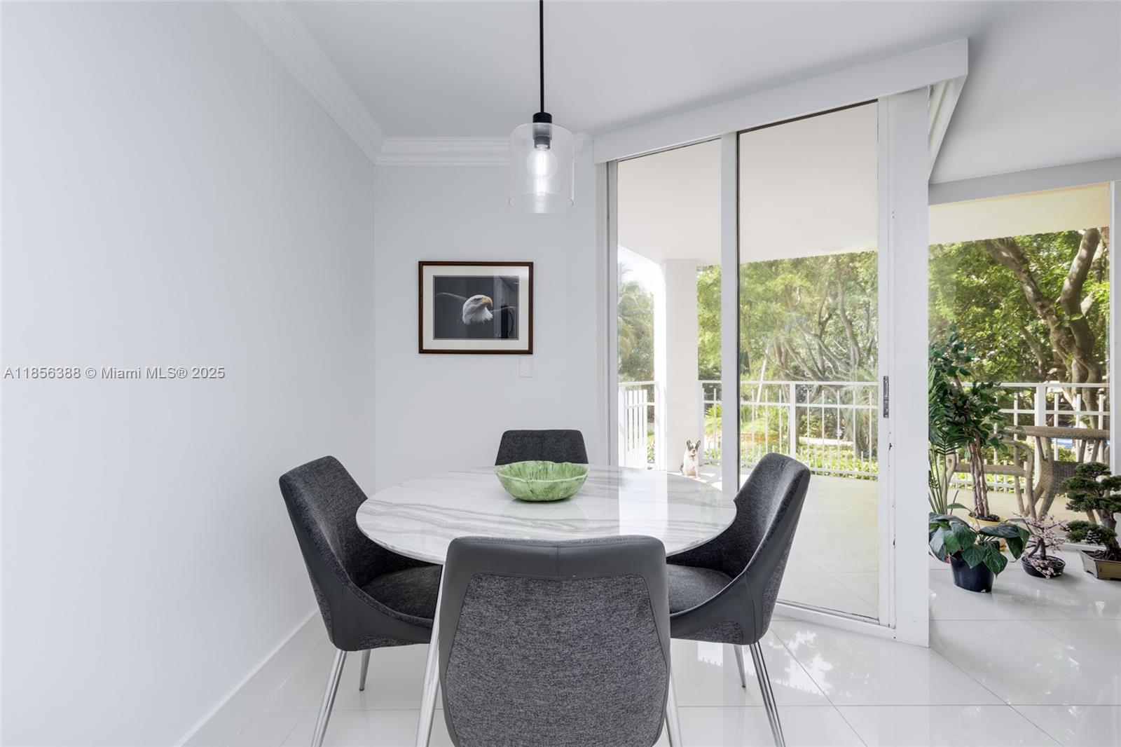 2000 Towerside Terrace, Unit 406 Miami, FL 33138 - Photo 15 of 56 a view of a dining room with furniture window and outside view