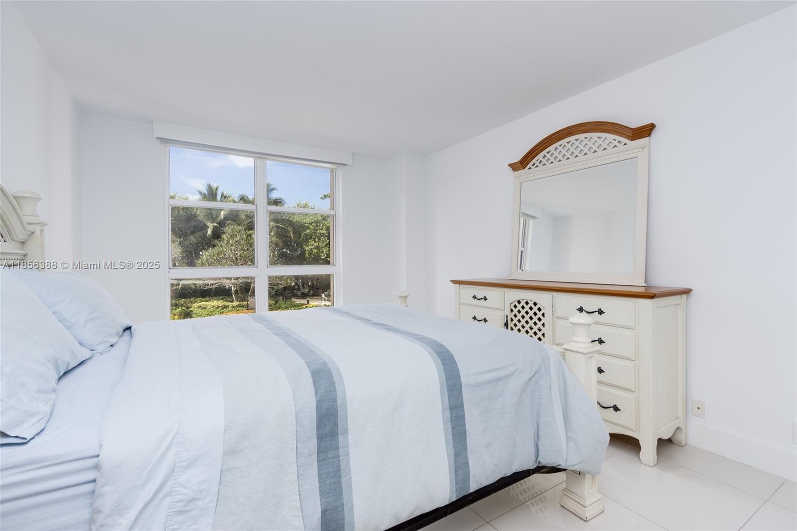 2000 Towerside Terrace, Unit 406 Miami, FL 33138 - Photo 30 of 56 a large white bed in a white room