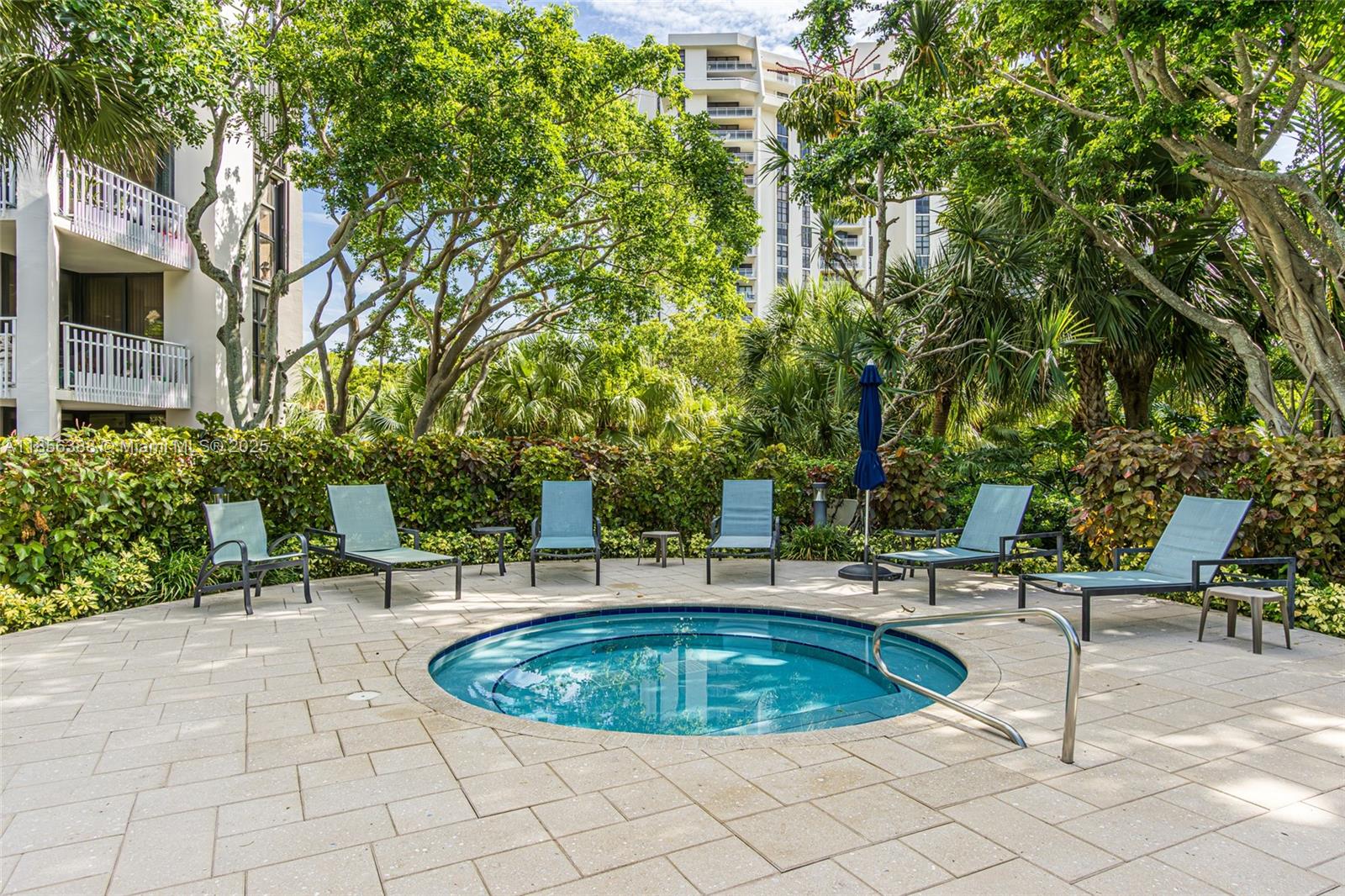 2000 Towerside Terrace, Unit 406 Miami, FL 33138 - Photo 37 of 56 a view of a swimming pool with chairs