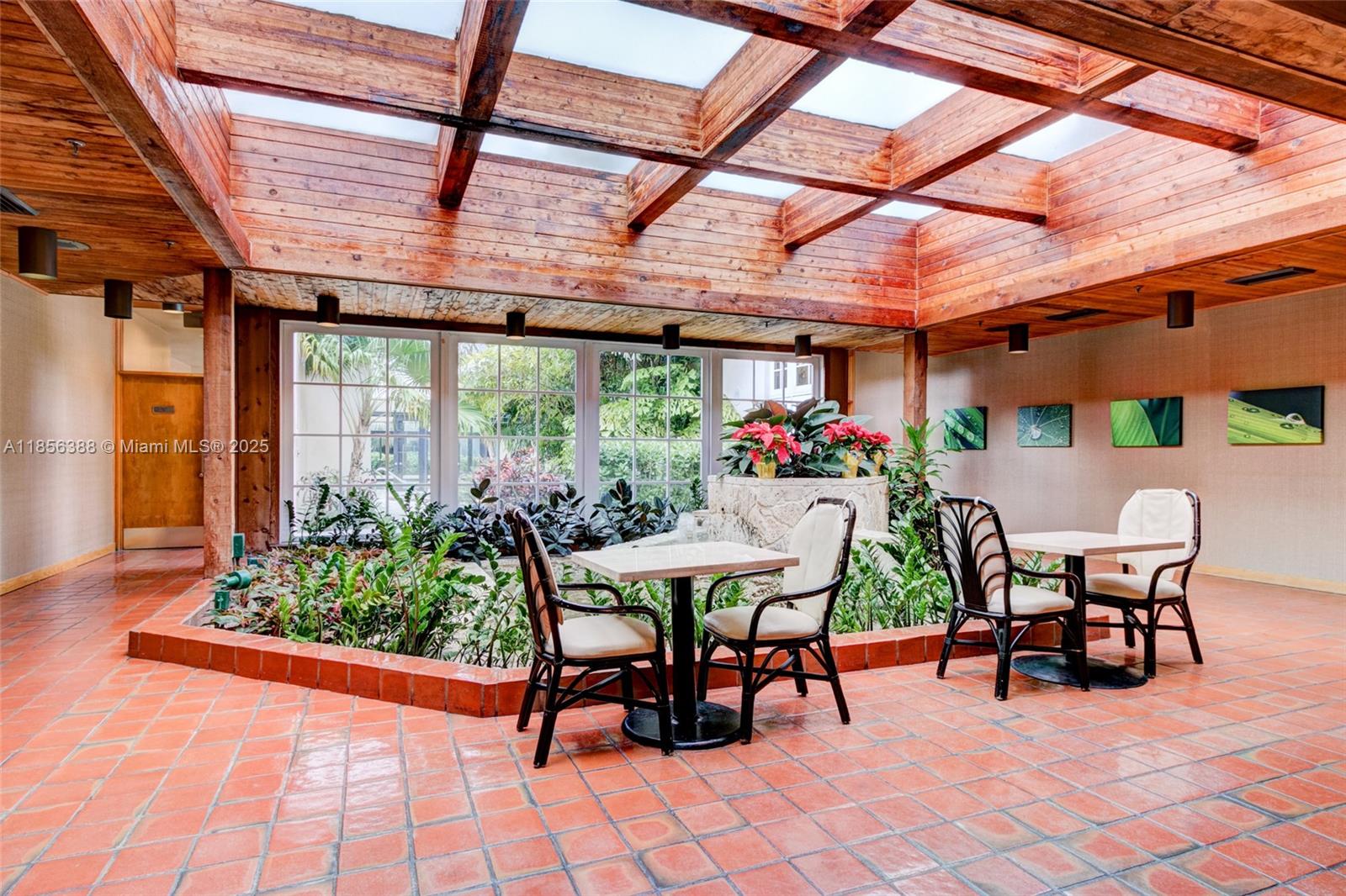 2000 Towerside Terrace, Unit 406 Miami, FL 33138 - Photo 44 of 56 a view of a dining room with furniture and wooden floor