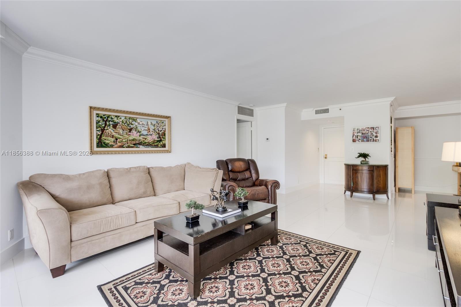 2000 Towerside Terrace, Unit 406 Miami, FL 33138 - Photo 8 of 56 a living room with furniture and a wooden floor