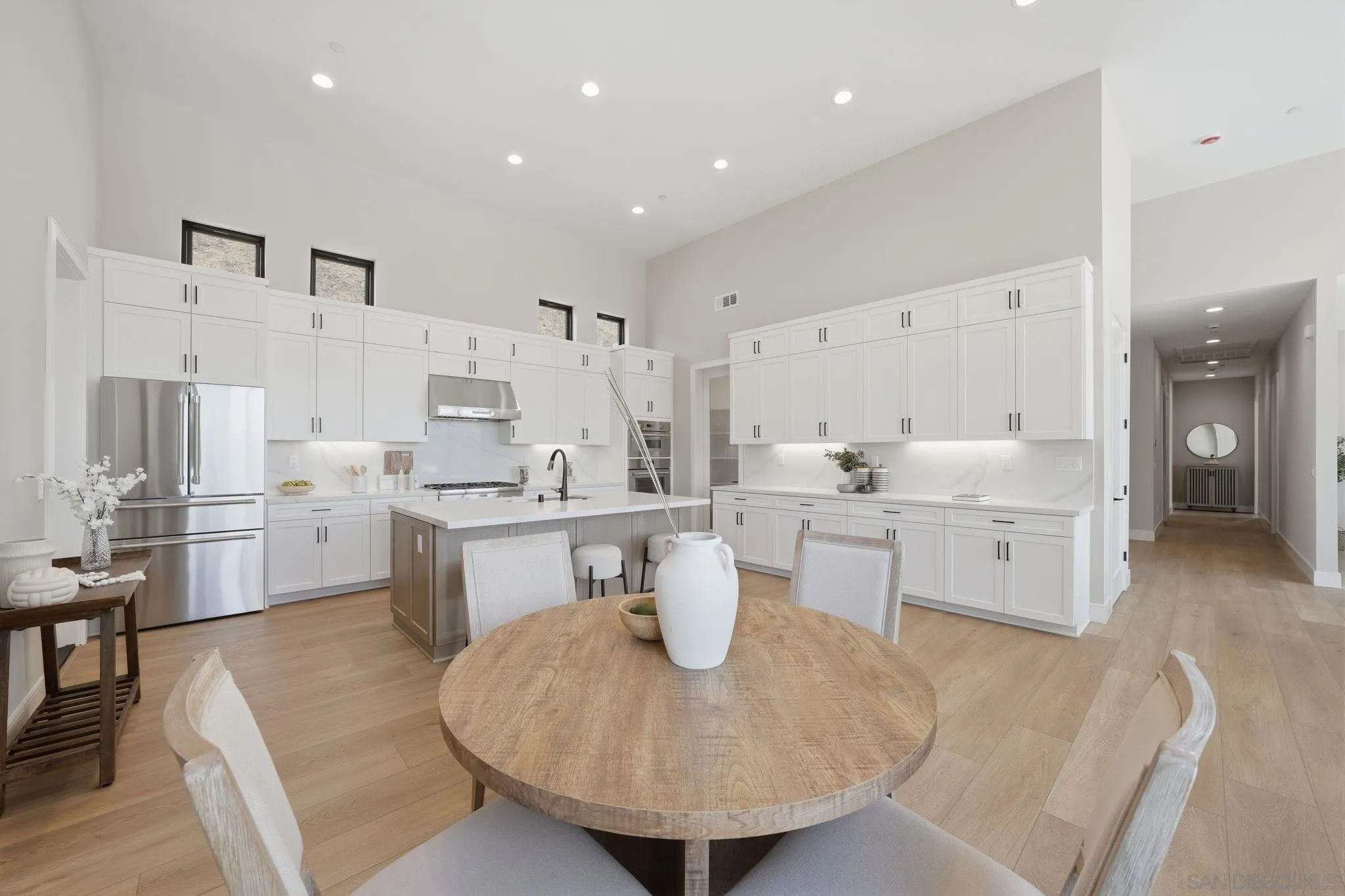 3916 Citrus Drive Fallbrook, CA 92028 - Photo 21 of 72 a kitchen with white cabinets and counter space