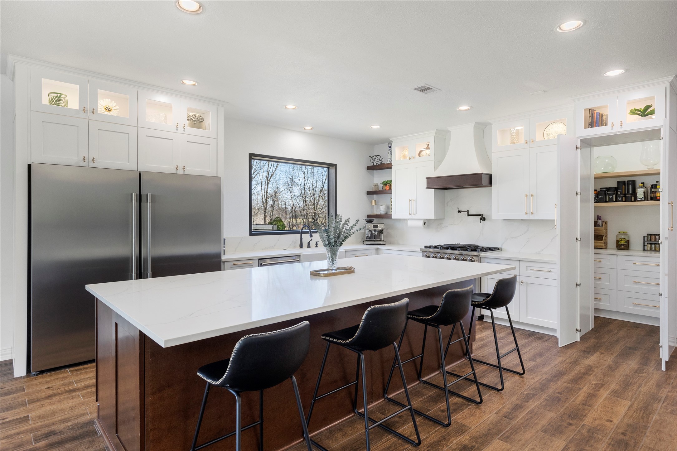 36345 Lady J Circle Wallis, TX 77485 - Photo 13 of 50 a kitchen with stainless steel appliances granite countertop a table chairs stove refrigerator and cabinets