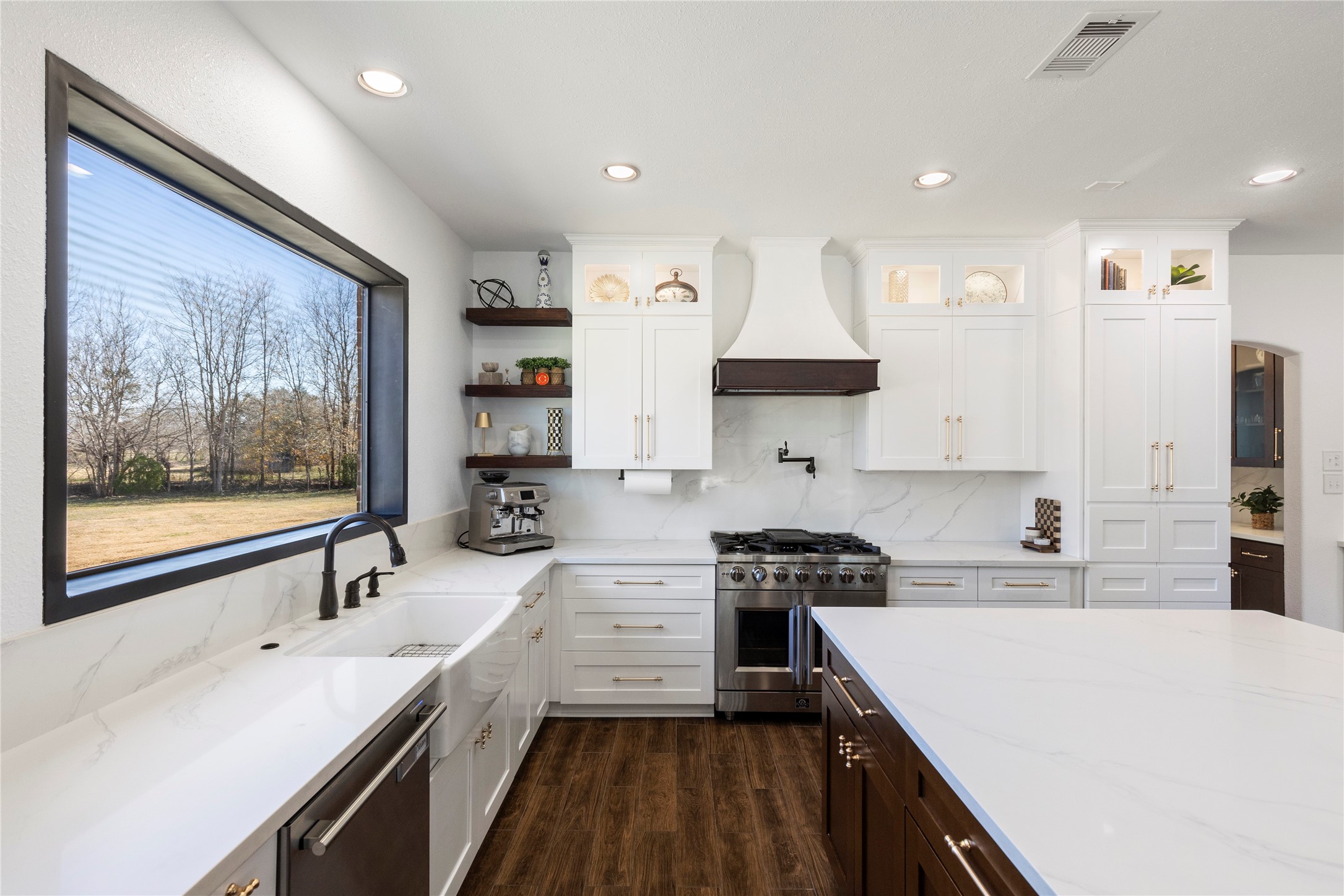 36345 Lady J Circle Wallis, TX 77485 - Photo 14 of 50 a kitchen with stainless steel appliances a sink stove and cabinets