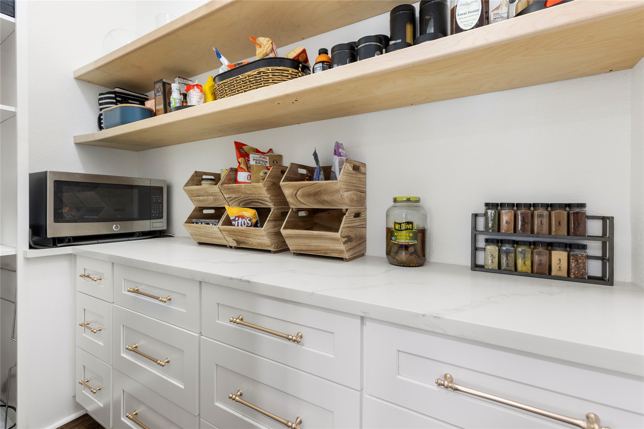 36345 Lady J Circle Wallis, TX 77485 - Photo 15 of 50 a kitchen with cabinets and a wooden floor